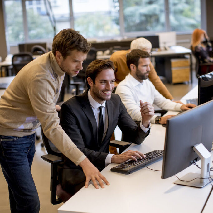 Senior businesswoman and young business people work in the modern office